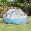 A pool dome covering a pool in a backyard. Voir les images du produit
