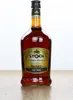 A bottle of Stock Bewährte Tradition liquor on a wooden surface against a white background. Produktbild-Vorschau