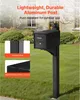 A black mailbox post with a mailbox attached, shown in a yard with a house in the background. Náhľad obrázku produktu