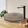 A modern bathroom sink and faucet setup on a wooden countertop. Produktbild-Vorschau