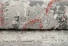 A close-up view of a rolled-up rug with a textured pattern. Produktbild-Vorschau