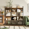 A bookshelf filled with decorative items and books in a living room setting. Produktbild-Vorschau