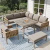 An outdoor patio set on a deck with a house and greenery in the background. Produktbild-Vorschau