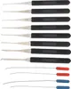 A set of lock picking tools and tension wrenches are laid out on a white background. Produktbild-Vorschau