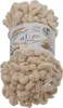 A ball of beige yarn with loops, on a white background. Náhled obrázku produktu