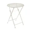 A cream-colored metal bistro table with a round, perforated top and folding legs, presented against a white background. Produktbild-Vorschau
