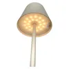 A close-up, low-angle view of a modern lamp with a conical shade and a bright LED light source visible inside. Produktbild-Vorschau