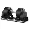A black adjustable dumbbell on a stand, shown against a white background. Produktbild-Vorschau