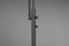 A close-up view of the dark gray metal pole of a floor lamp, showing two black adjustment knobs. Náhled obrázku produktu