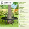 A black metal garden bench around a tree trunk in a garden setting. Produktbild-Vorschau