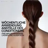 A person's back and hair are shown, with text overlayed. Anteprima dell’immagine prodotto