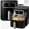 Two black air fryers are shown, one in the foreground with steam rising and french fries and chicken wings inside, and another in the background. A metal rack is also visible. Produktbild-Vorschau