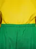 A close-up view of a yellow top and green pants with an elastic waistband. Produktbild-Vorschau