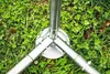 Close-up view of the base of a metal structure on grass. Voir les images du produit