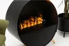 A modern black fireplace with a realistic flame effect is shown in a studio setting. Náhled obrázku produktu