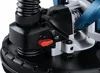 A close-up view of the controls and dust extraction port of a power tool. Podgląd zdjęcia produktu