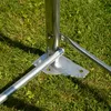Close-up of the base of a metal structure on grass. Voir les images du produit