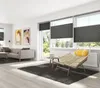 A modern living room with a sofa, chair, and large windows with blinds. Produktbild-Vorschau