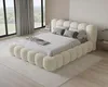 A bedroom setting with a bed, curtains, and a window view. Voir les images du produit