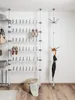A storage system with shelves for shoes and a coat rack with an umbrella. Produktbild-Vorschau