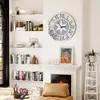 A living room scene with a large wall clock, bookshelves, and a fireplace. Anteprima dell’immagine prodotto