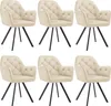 Six cream-colored velvet armchairs with tufted backs and black metal legs are arranged in two rows of three against a white background. Voir les images du produit