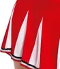 Close-up of a pleated skirt with red and white panels and black and white trim. Produktbild-Vorschau
