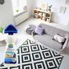 A living room scene with a cleaning product in the foreground and furniture in the background. Podgląd zdjęcia produktu