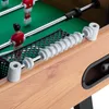 A close-up view of a foosball table, focusing on the score counter and part of the playing field. Náhľad obrázku produktu