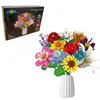 A building block flower bouquet in a vase, next to its packaging. Náhľad obrázku produktu