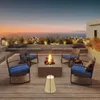 A rooftop patio with a fire pit and seating area overlooking the ocean at sunset. Produktbild-Vorschau