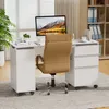 A white desk with a computer, chair, and storage units in a home office setting. Produktbild-Vorschau