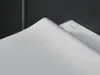 A close-up view of a white toilet seat with a dark gray wall in the background. Anteprima dell’immagine prodotto