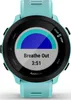 A close-up view of a turquoise Garmin Forerunner 55 smartwatch displaying a breathing exercise. Podgląd zdjęcia produktu