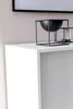 A close-up shot of a black bowl on a white shelf. Náhled obrázku produktu