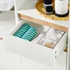 A close-up shot of an open drawer revealing bathroom accessories. Anteprima dell’immagine prodotto