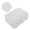 Two stacked white terry cloth fitted sheets with a close-up inset of the fabric texture. Produktbild-Vorschau