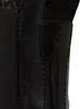A close-up view of a black leather boot, focusing on the side panel and elasticated gore. Anteprima dell’immagine prodotto