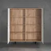 An open, empty highboard with wooden shelves against a gray wall. Podgląd zdjęcia produktu