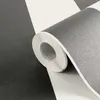 A close-up view of a roll of black and white striped wallpaper. Produktbild-Vorschau