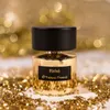 A bottle of Tiziana Terenzi Kirke perfume is displayed on a white surface, surrounded by gold glitter and bokeh lights in the background. Produktbild-Vorschau