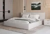A modern bedroom with a bed, nightstand, and wardrobe. Produktbild-Vorschau
