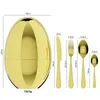 A golden egg-shaped container with cutlery laid out next to it, with dimensions indicated by lines and text. Produktbild-Vorschau