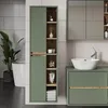 A modern bathroom with a tall green cabinet and a vanity with a sink. Náhled obrázku produktu