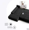 A dark gray sectional sofa is shown with a small inset image of a woman stretching in bed. Náhled obrázku produktu