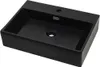 A black ceramic sink with a faucet hole and drain hole, shown from a slightly elevated angle against a white background. Produktbild-Vorschau