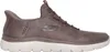 A side view of a brown Skechers slip-on sneaker with a white sole. Produktbild-Vorschau