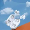 Several white earbuds and their charging case are shown floating against a blue sky with clouds, with an orange surface in the foreground. Anteprima dell’immagine prodotto