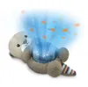 A plush otter toy projecting a blue light with orange fish silhouettes. Produktbild-Vorschau
