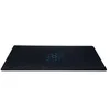 A black gaming mousepad with a hexagonal pattern and a blue glowing honeycomb design in the center, presented on a white background. Voir les images du produit